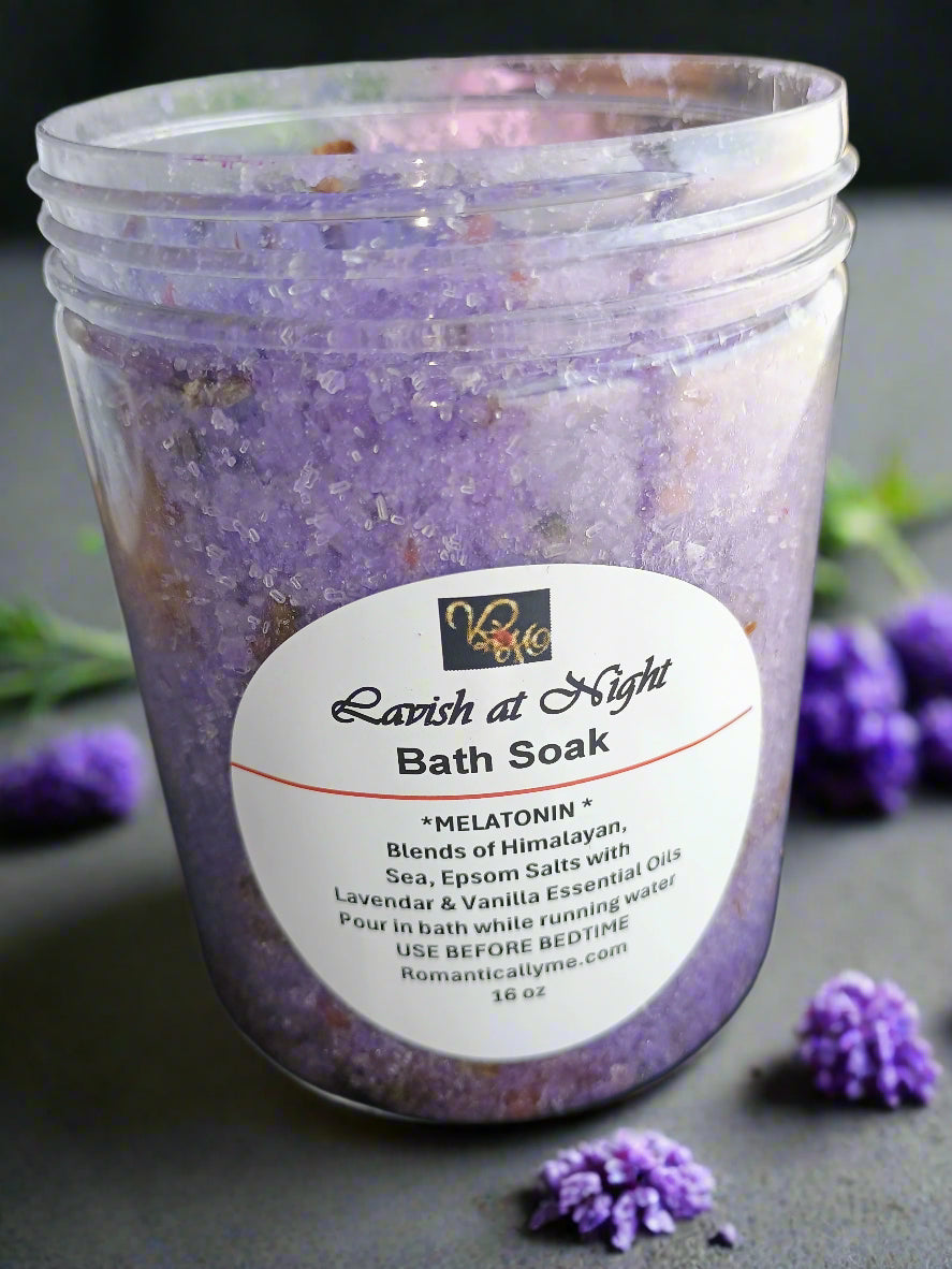 Purple bath soak in a jar with a label on a dark surface